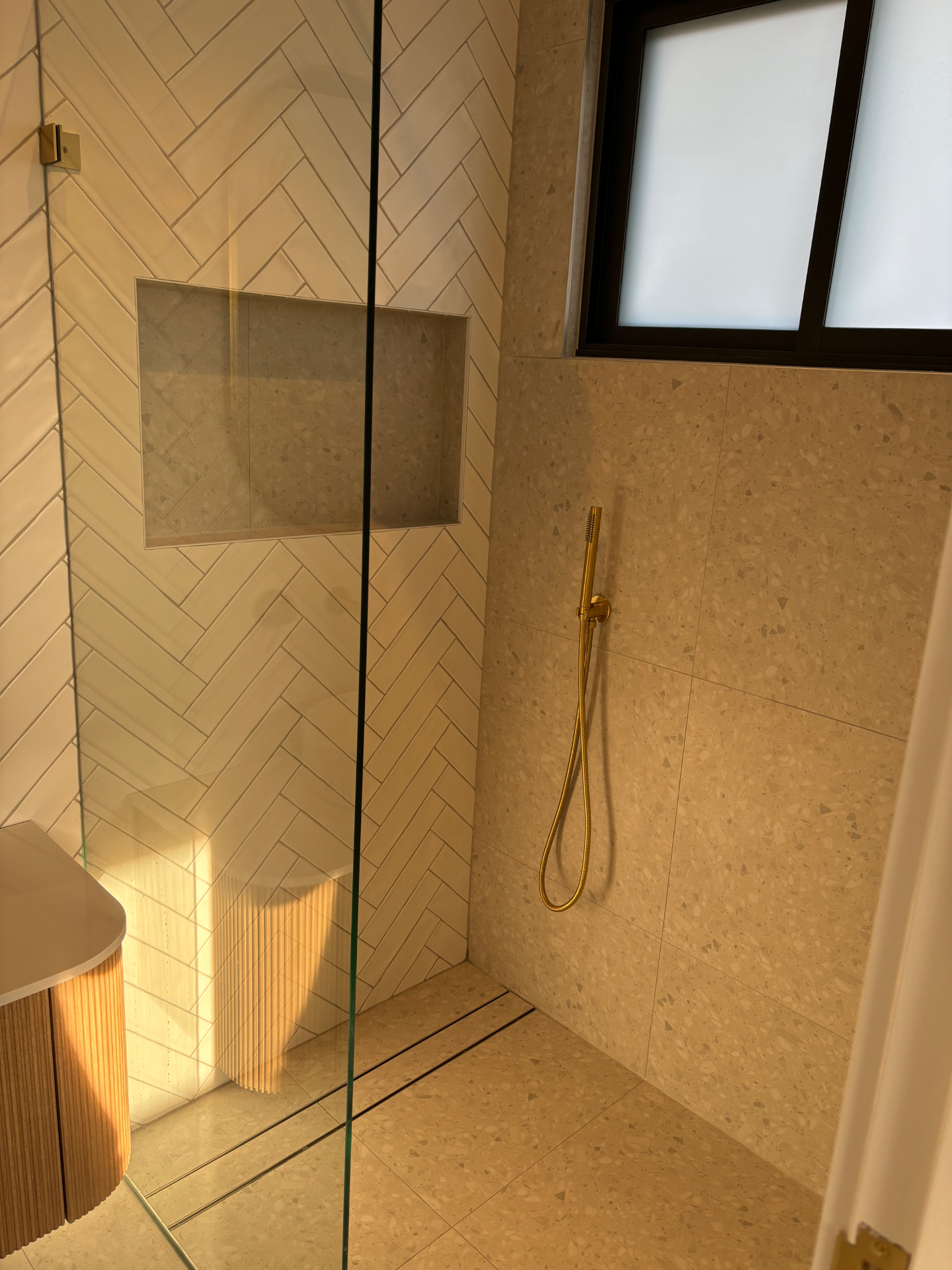 Sparkling bathroom with herringbone tiles