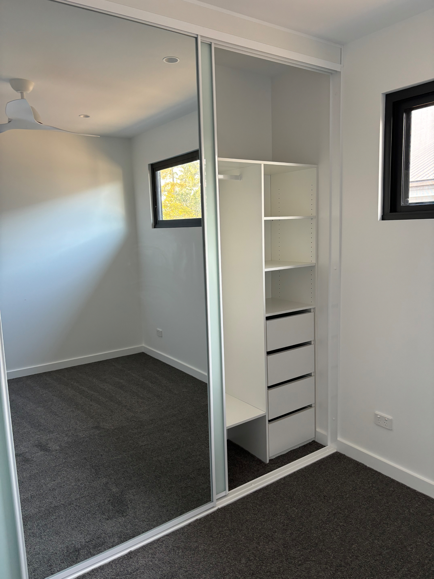 Neat bedroom with tidy built-in wardrobe