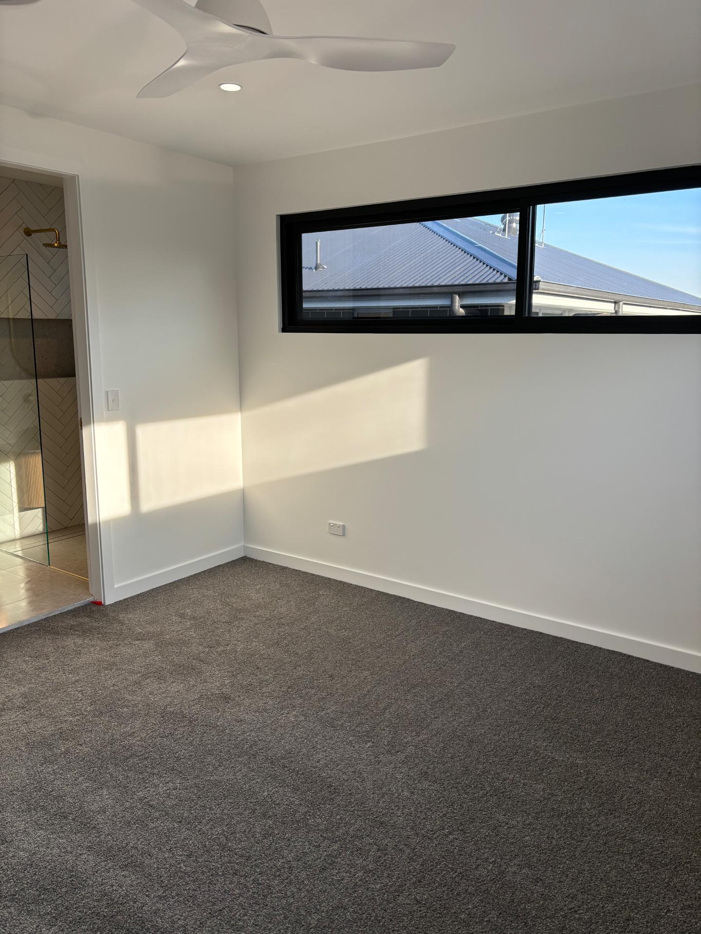 Fresh carpeted bedroom with natural light
