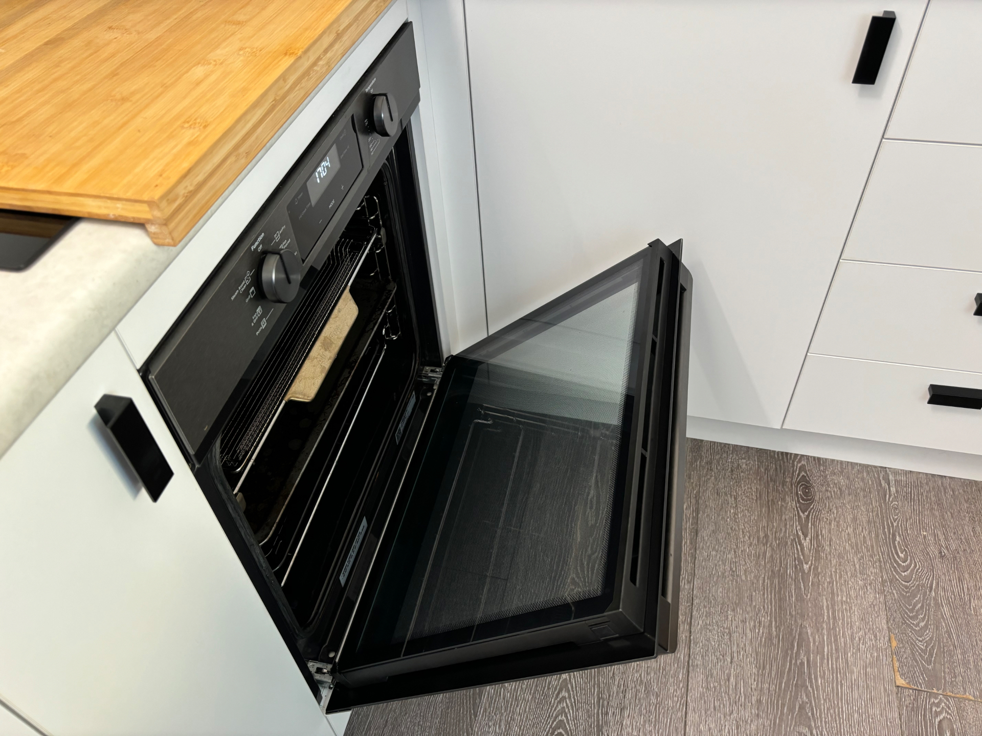 Clean kitchen with pristine oven and counters